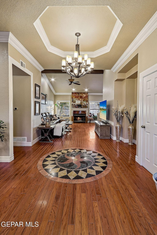 interior space featuring a textured ceiling, a fireplace, and wood-type flooring