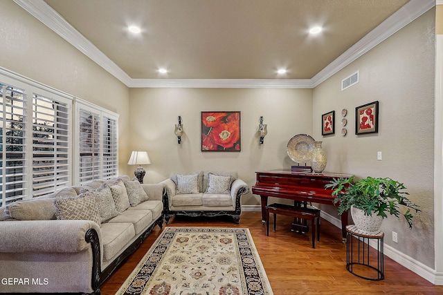 living room with ornamental molding and hardwood / wood-style floors