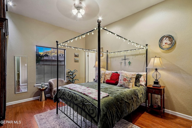 bedroom featuring ceiling fan and wood-type flooring