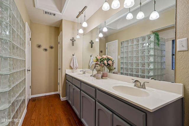 bathroom with hardwood / wood-style floors and vanity