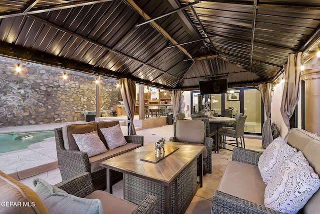 view of patio featuring an outdoor hangout area and a gazebo