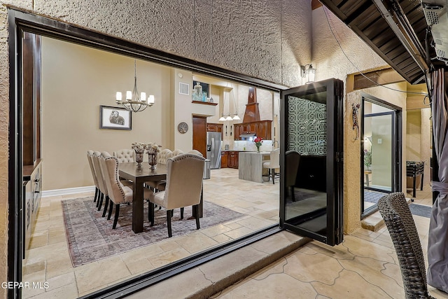 dining area featuring a chandelier