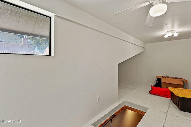 interior space featuring ceiling fan