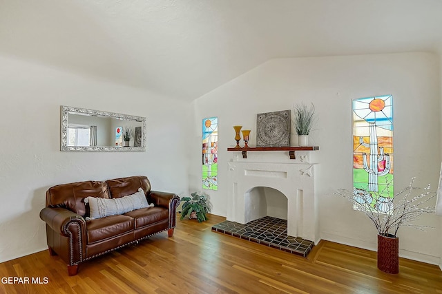 living room with wood-type flooring and lofted ceiling