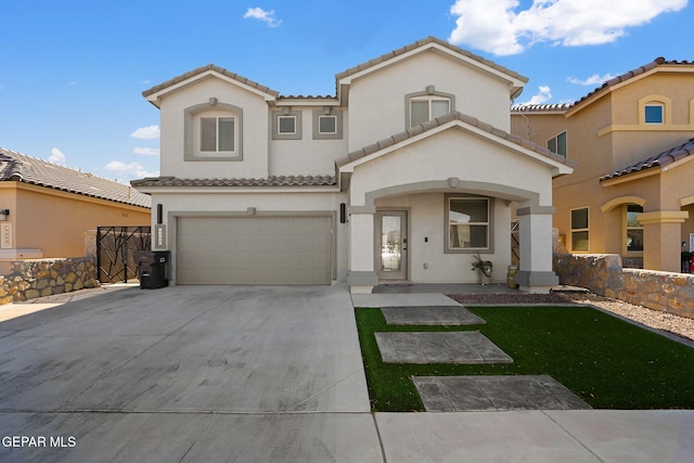 mediterranean / spanish home featuring a garage