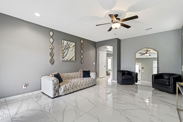 living room featuring ceiling fan