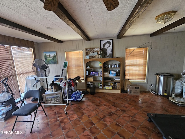 workout area featuring wood walls