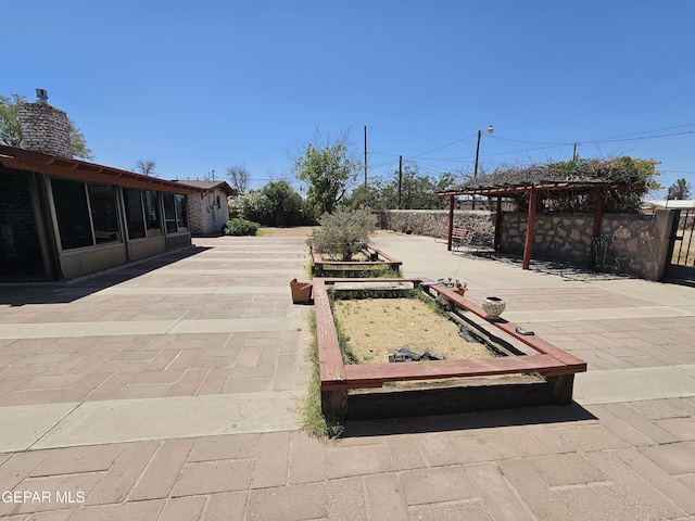 exterior space featuring a pergola and a patio