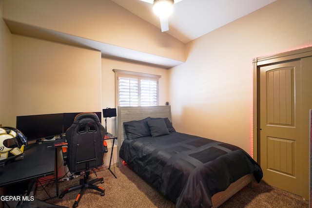 carpeted bedroom with vaulted ceiling and ceiling fan