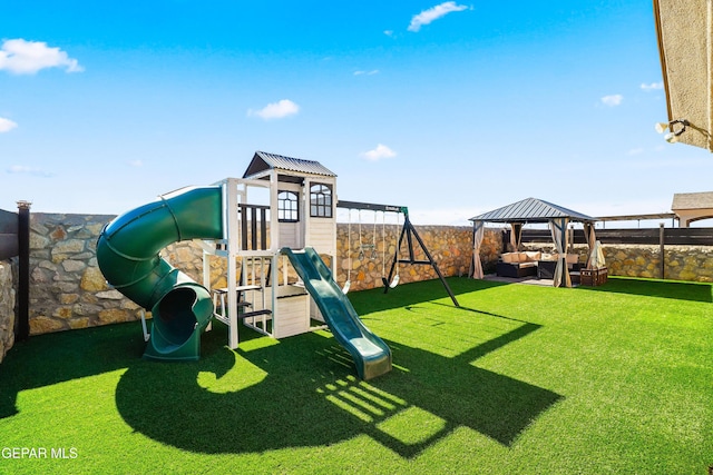 view of playground featuring a gazebo, a lawn, and an outdoor hangout area