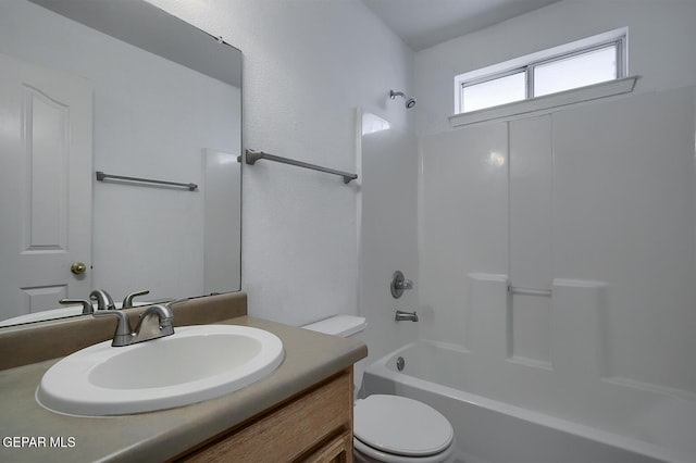 full bathroom featuring vanity,  shower combination, and toilet