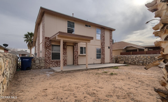 rear view of property featuring a patio area