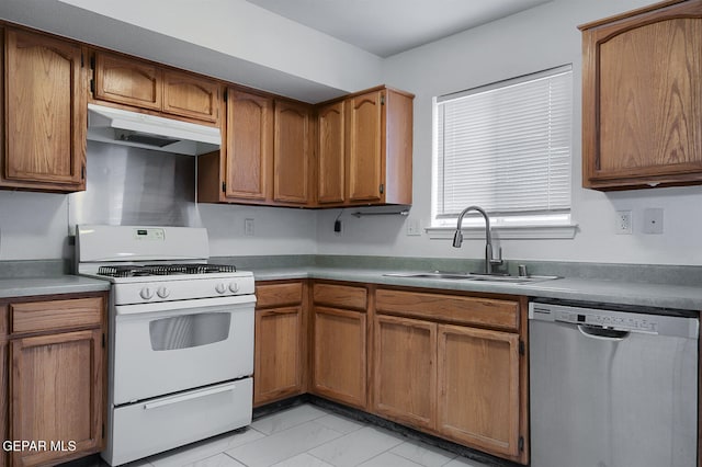 kitchen with dishwasher, white gas stove, and sink