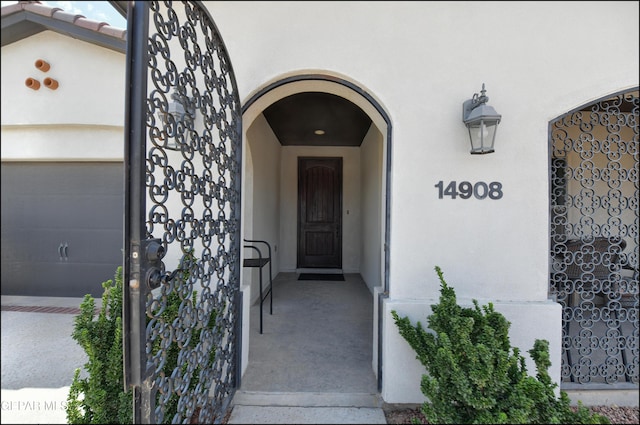 doorway to property featuring a garage