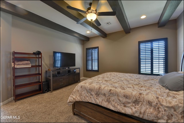 bedroom featuring carpet, beam ceiling, and ceiling fan