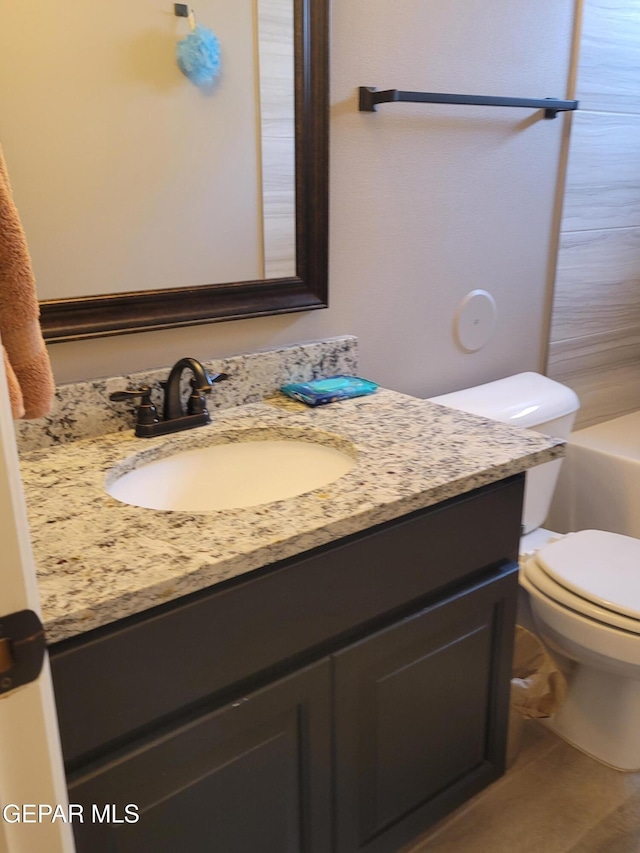 full bathroom featuring vanity, shower with separate bathtub, and toilet