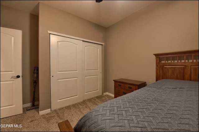 bedroom with light colored carpet and a closet