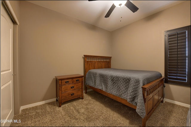 carpeted bedroom featuring a closet, ceiling fan, and lofted ceiling