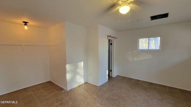 empty room featuring ceiling fan