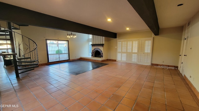 unfurnished living room featuring an inviting chandelier, beamed ceiling, and light tile patterned flooring