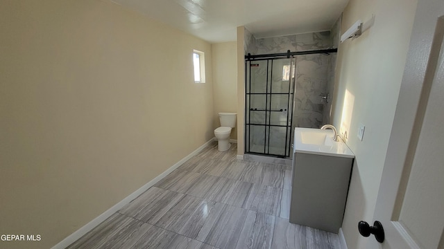 bathroom featuring walk in shower, vanity, and toilet