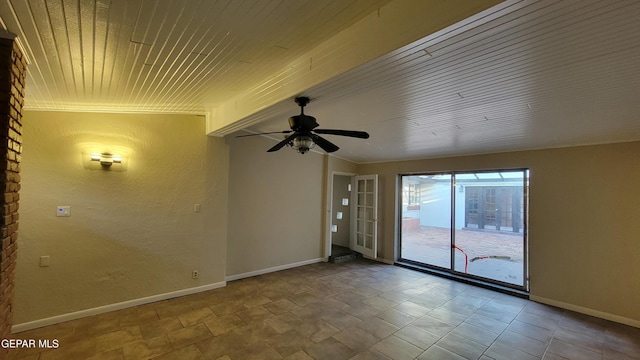 empty room featuring wood ceiling and ceiling fan