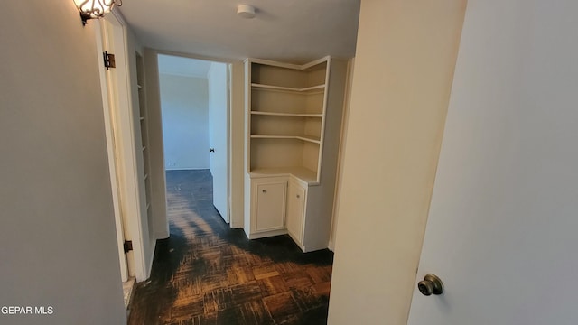 hallway featuring dark parquet floors