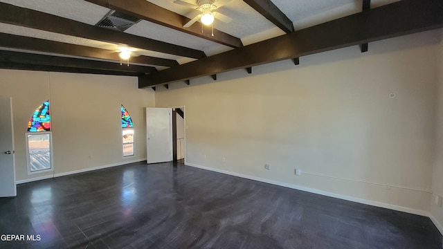 spare room with ceiling fan, dark hardwood / wood-style flooring, and lofted ceiling with beams