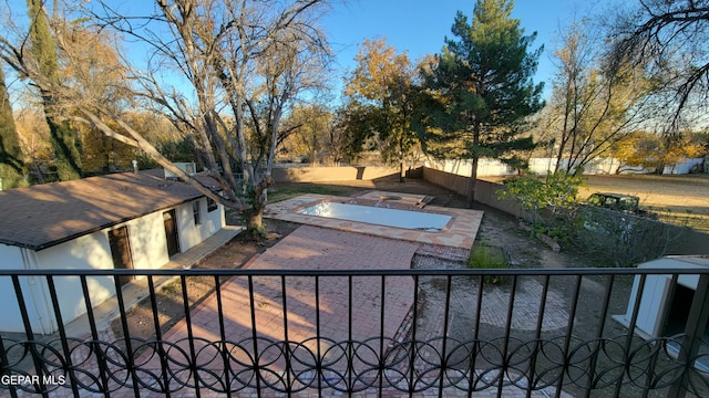 exterior space featuring a swimming pool and a patio area