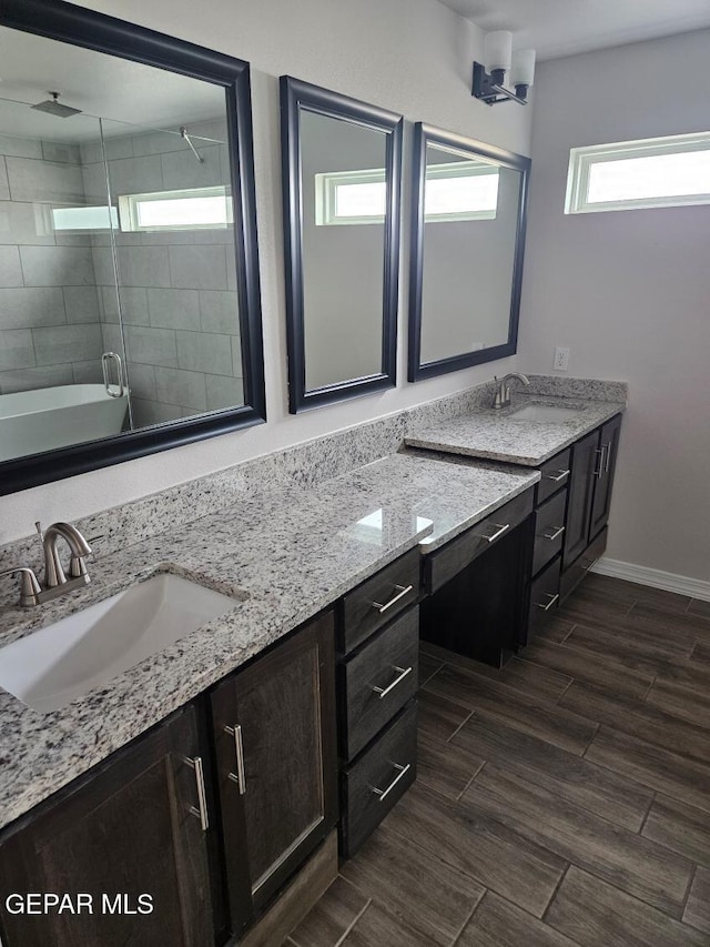 bathroom with vanity and an enclosed shower