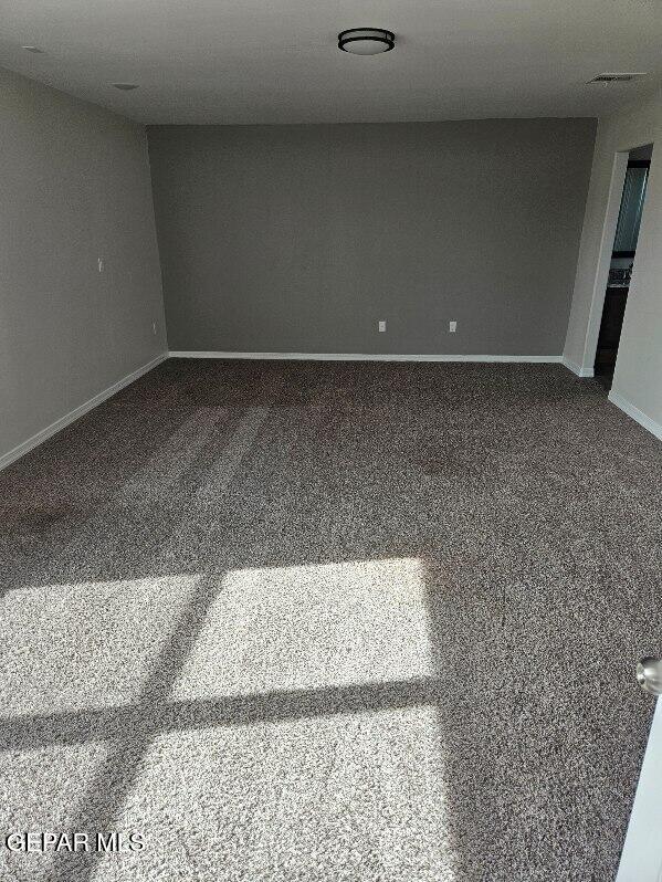 unfurnished room featuring carpet flooring