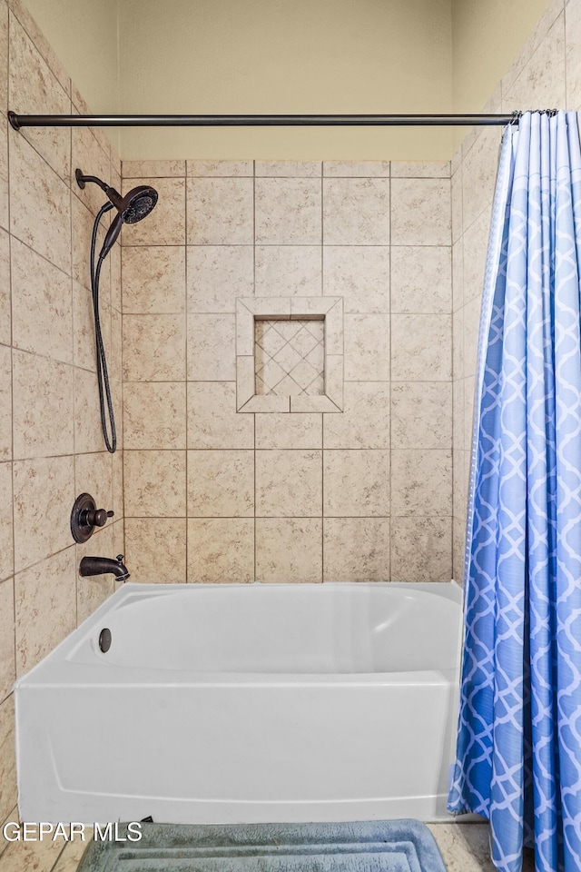 full bathroom featuring shower / bath combination with curtain