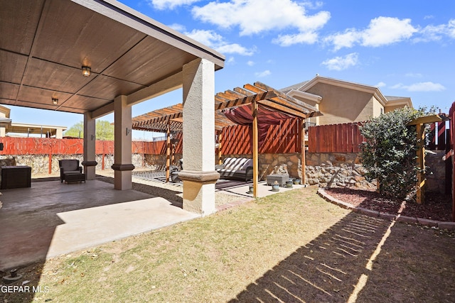 view of patio featuring outdoor lounge area, a fenced backyard, and a pergola