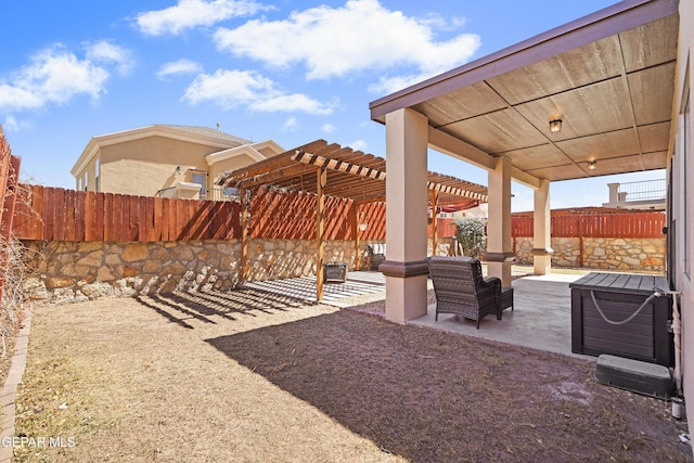 exterior space with a patio area, a pergola, and a fenced backyard