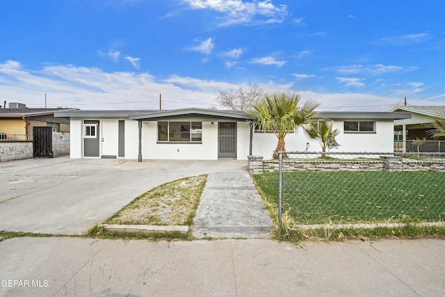 ranch-style home with a front yard