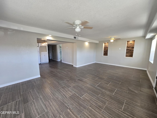 unfurnished room with ceiling fan