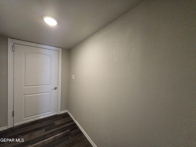 hall featuring dark wood-type flooring