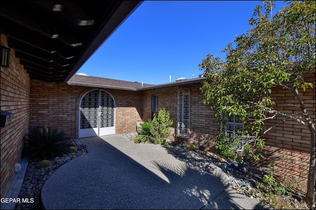 property entrance with a patio