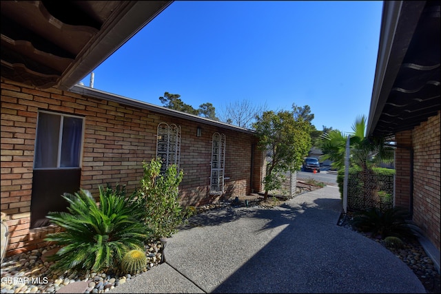 view of side of property featuring a patio