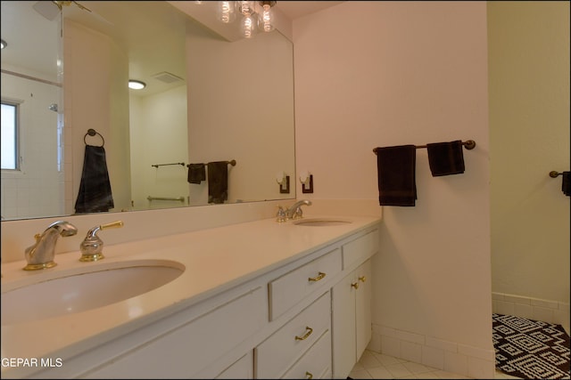 bathroom with vanity and tile patterned flooring