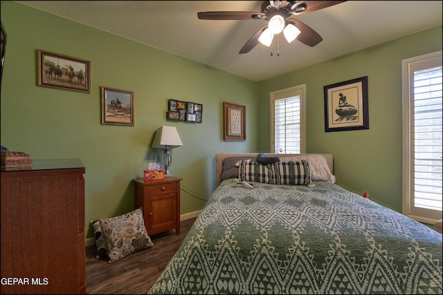 bedroom with dark wood-type flooring and ceiling fan