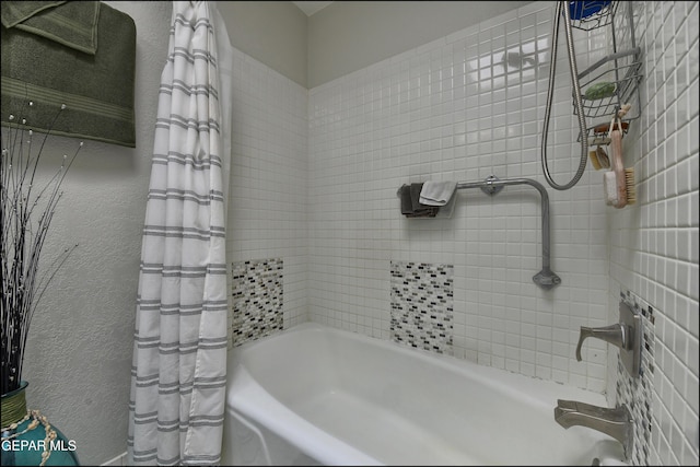 bathroom with shower / bathtub combination with curtain