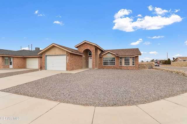 ranch-style house featuring a garage