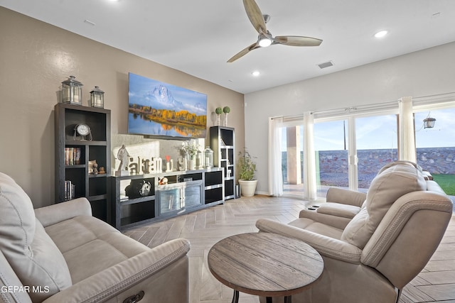 living room with light parquet floors and ceiling fan