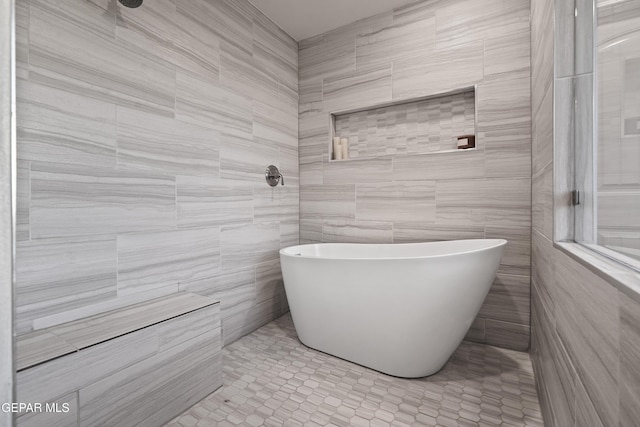 bathroom featuring tile walls