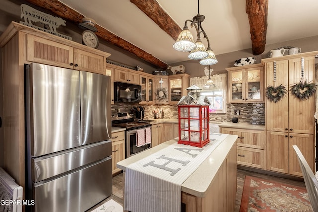 kitchen with a kitchen island, appliances with stainless steel finishes, decorative light fixtures, beamed ceiling, and decorative backsplash