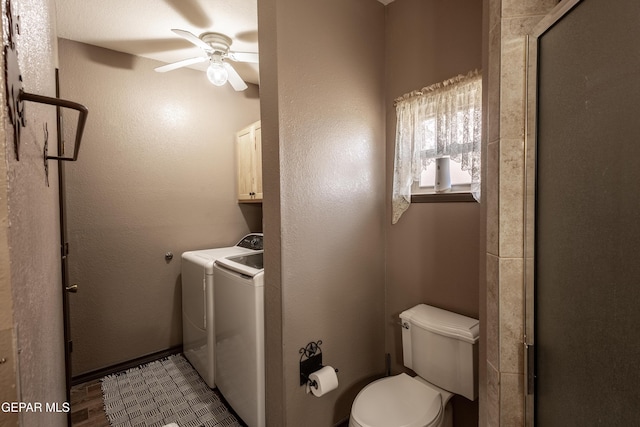 bathroom with ceiling fan, washing machine and clothes dryer, toilet, and hardwood / wood-style flooring