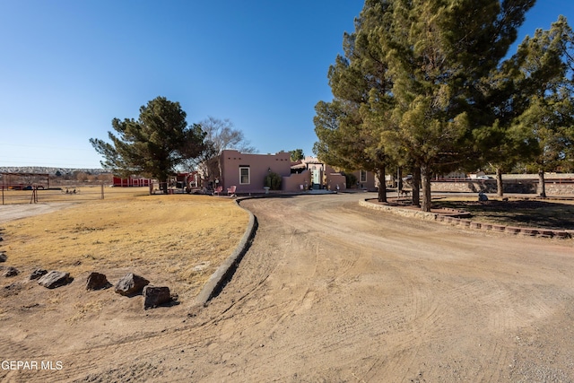 view of front facade featuring a rural view