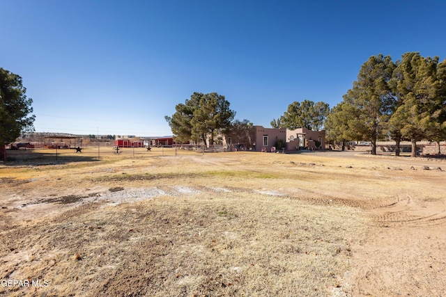 view of yard with a rural view