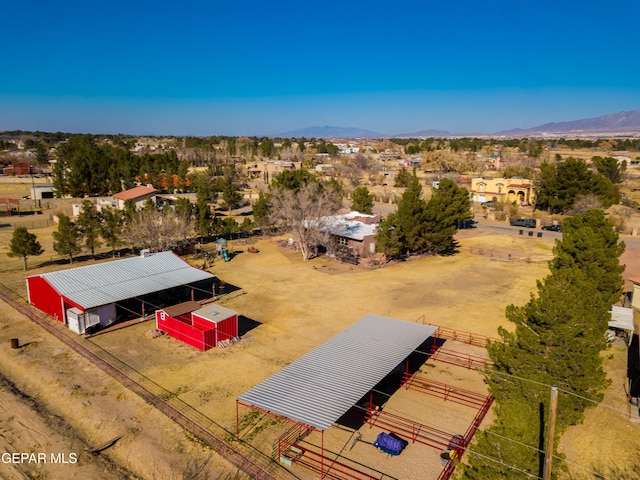 birds eye view of property featuring a mountain view